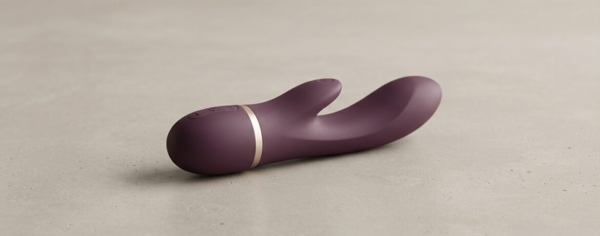 Vibrador premium de silicone em fundo neutro, ilustrando a relação entre o vibrador e bem-estar feminino.